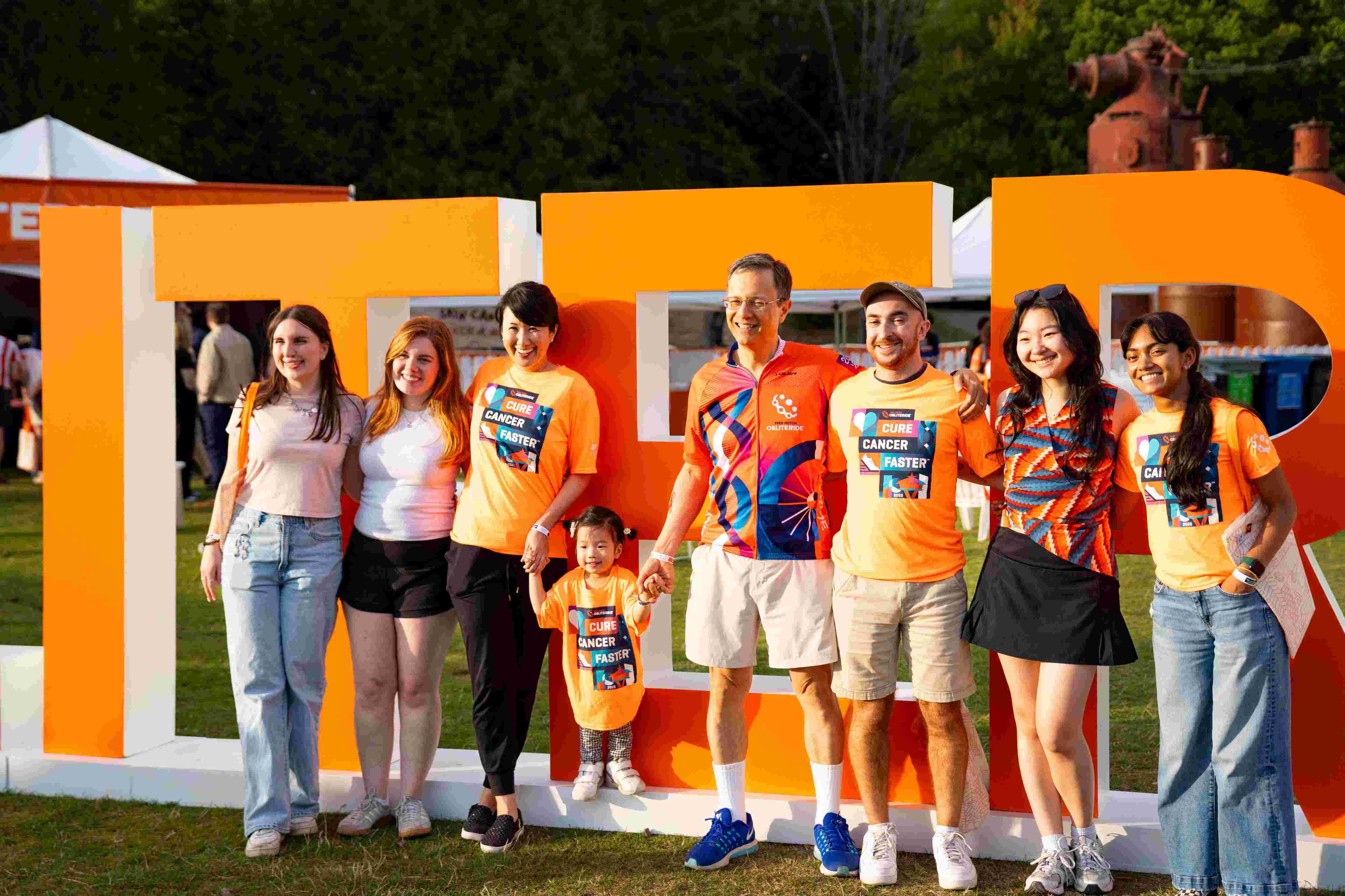 Team Skin in the Game posing with big letters